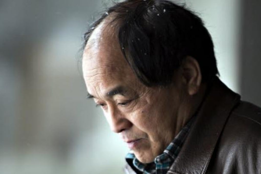 Daran Lin, father of murder victim Jun Lin, leaves the court after the end of the preliminary hearing in Montreal. Photo: AP