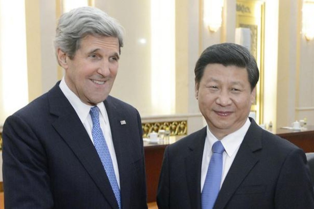 US Secretary of State John Kerry with President Xi. Photo: AFP