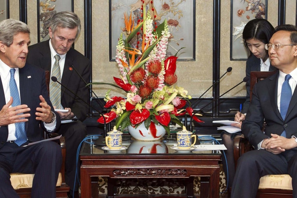 US Secretary of State John Kerry speaks with State Councillor Yang Jiechi during their meeting in Beijing on Saturday. The next high-level meeting will be in July. Photo: AP