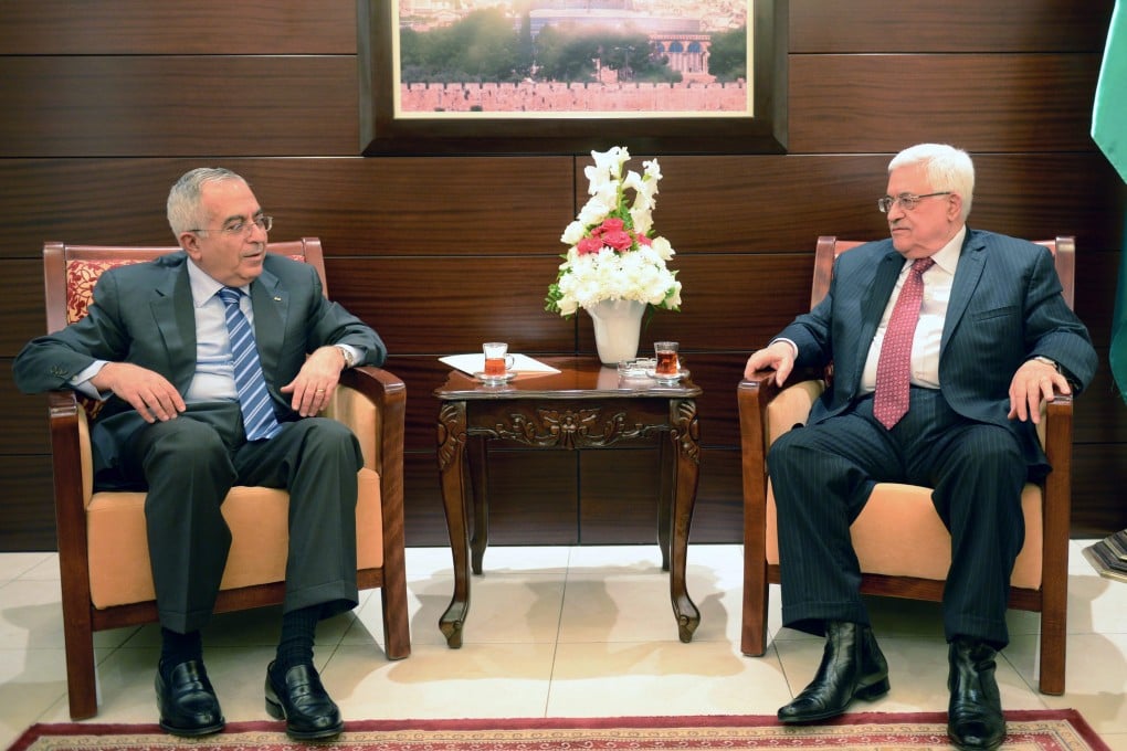 Palestinian President Mahmoud Abbas (right) meets with Prime Minister Salam Fayyad, in the West Bank town of Ramallah on Saturday. Photo: EPA