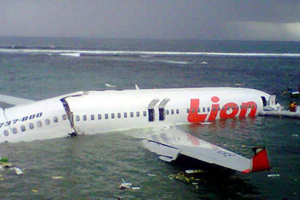 Lion Air's Boeing jet split in two in a crash after the plane overshot the runway in Bali on Saturday. Photo: AFP