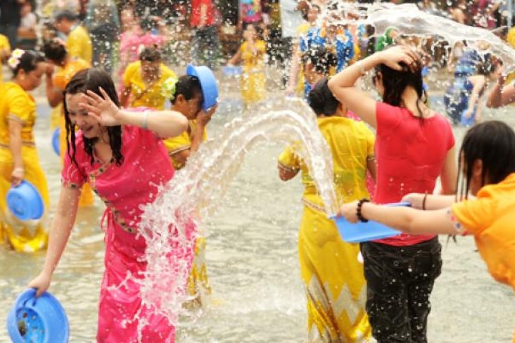 People take part in the Water Splashing Festival in Jinghong, southwest China's Yunnan province, on Monday. Photo: Xinhua