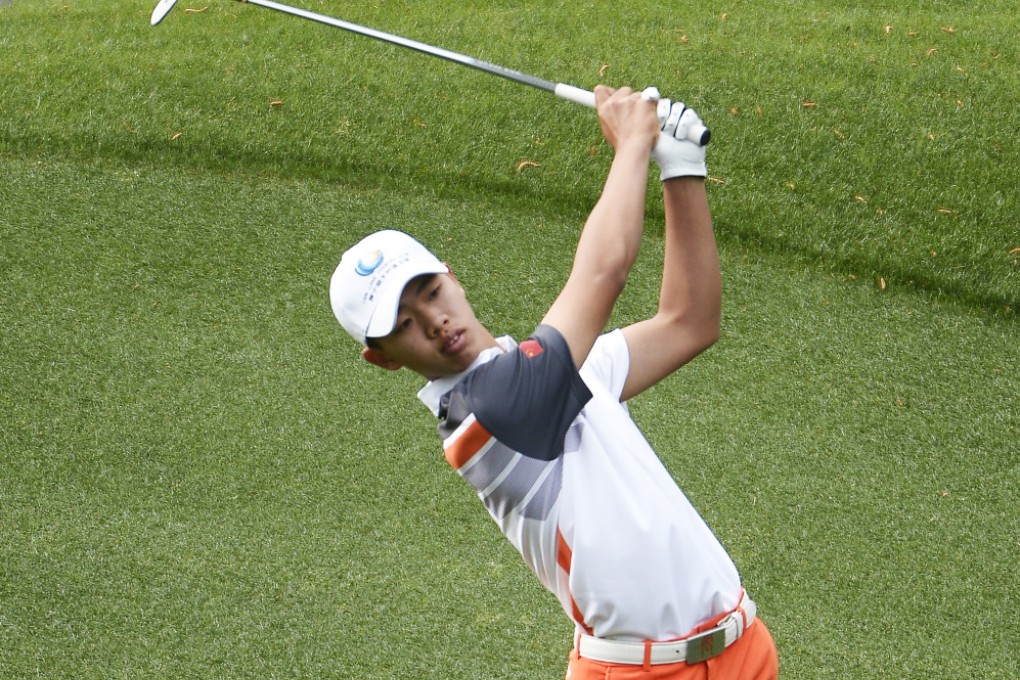 Guan Tianlang hits from the fairway on the third hole during the final round at Augusta National. Photo: EPA