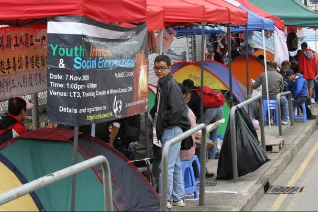 Dock workers occupy a road outside Kwai Chung Container Terminal. Photo: Edward Wong
