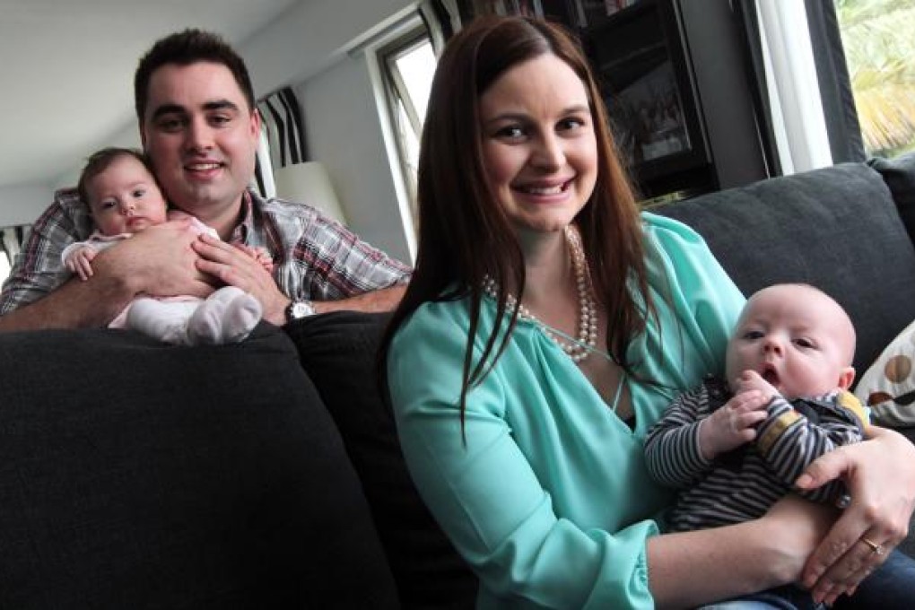 Tom Hegarty (left) with his daughter Imogen and his wife Alicia Eaton (right) with son Peter. Photo: May Tse