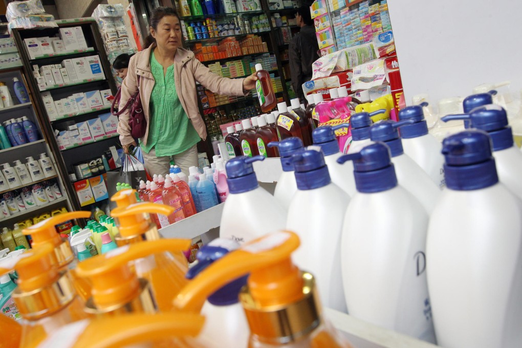 A woman risks paying extra for Dettol in Fanling. Photo: Felix Wong