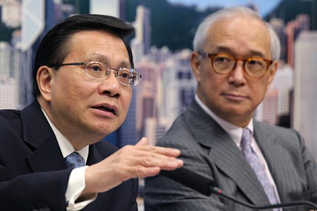 Anthony Cheung Bing-leung (left), Secretary for Transport and Housing, and Raymond Ch'ien, MTR chairman, announce the new fare rise on Tuesday. Photo: Dickson Lee