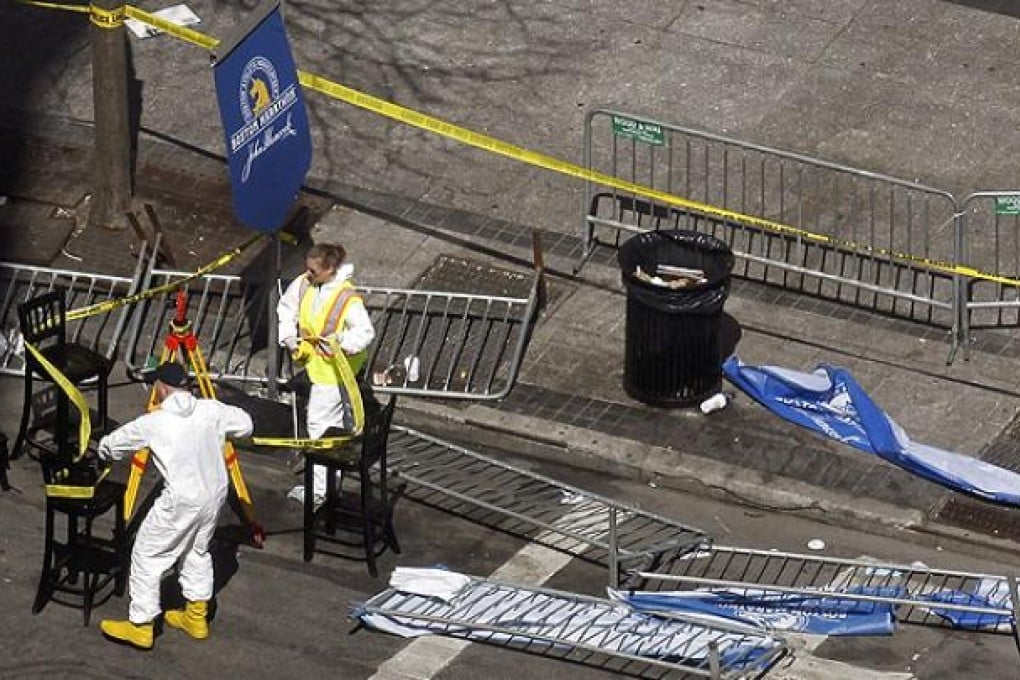 FBI investigators seal off the crime scene in central Boston. Photo: AFP