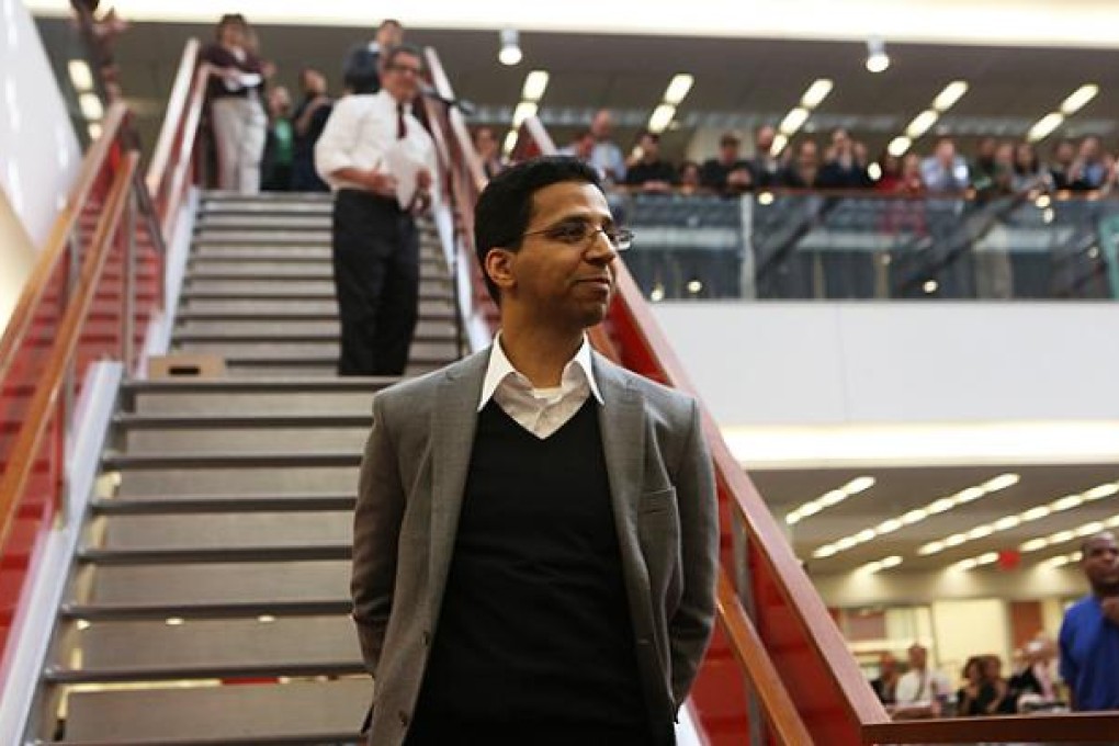 David Barboza of The New York Times is congratulated by colleagues in New York on Monday. Photo: NYT
