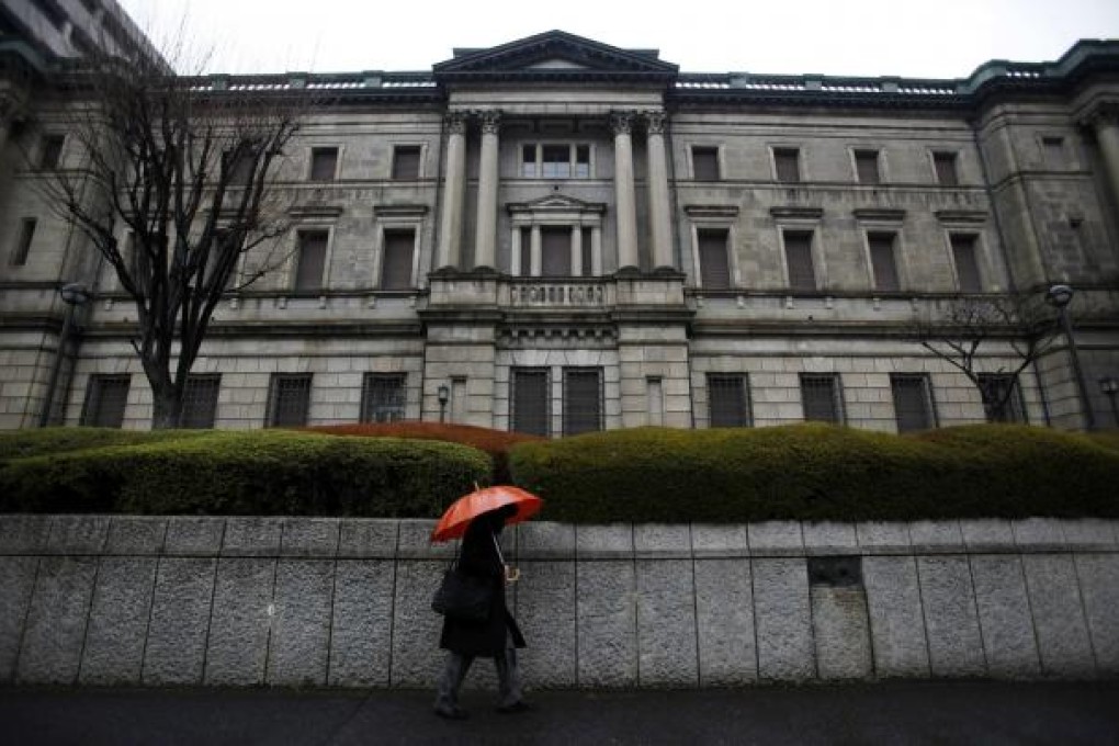 Since the bubble economy burst at the beginning of the 1990s, Japan's gross government debt has expanded from 66 per cent of GDP to reach 245 per cent last year, as banks rely on increasing purchases of government bonds to make up for falling demand for loans from Japan's risk-averse businesses and individual borrowers. Photo: Reuters