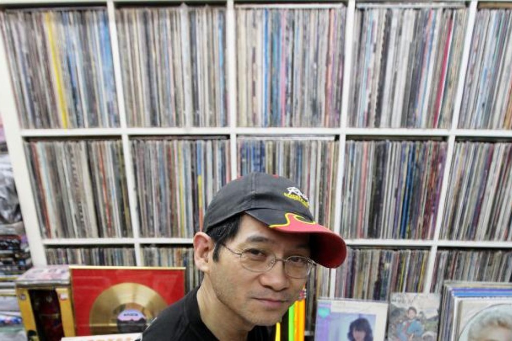 Paul Au at his Shum Shui Po shop. "The records are my family." Photo: K.Y. Cheng