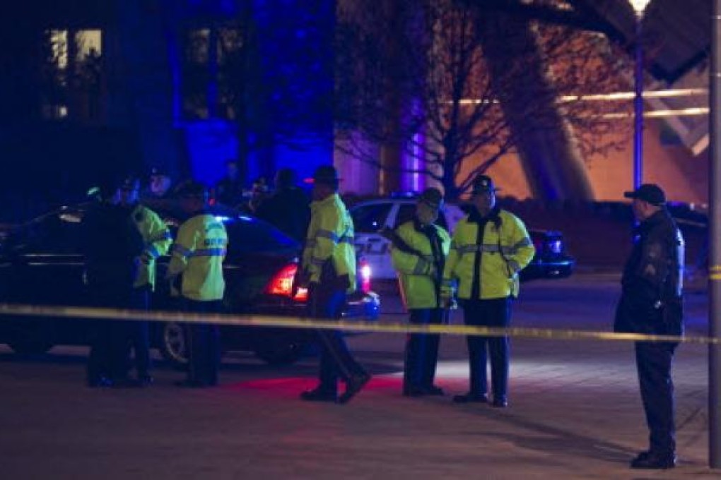 Massachusetts State Police and MIT police search at the scene of the shooting of a Massachusetts Institute of Technology police officer in Cambridge, Massachusetts. Photo: EPA