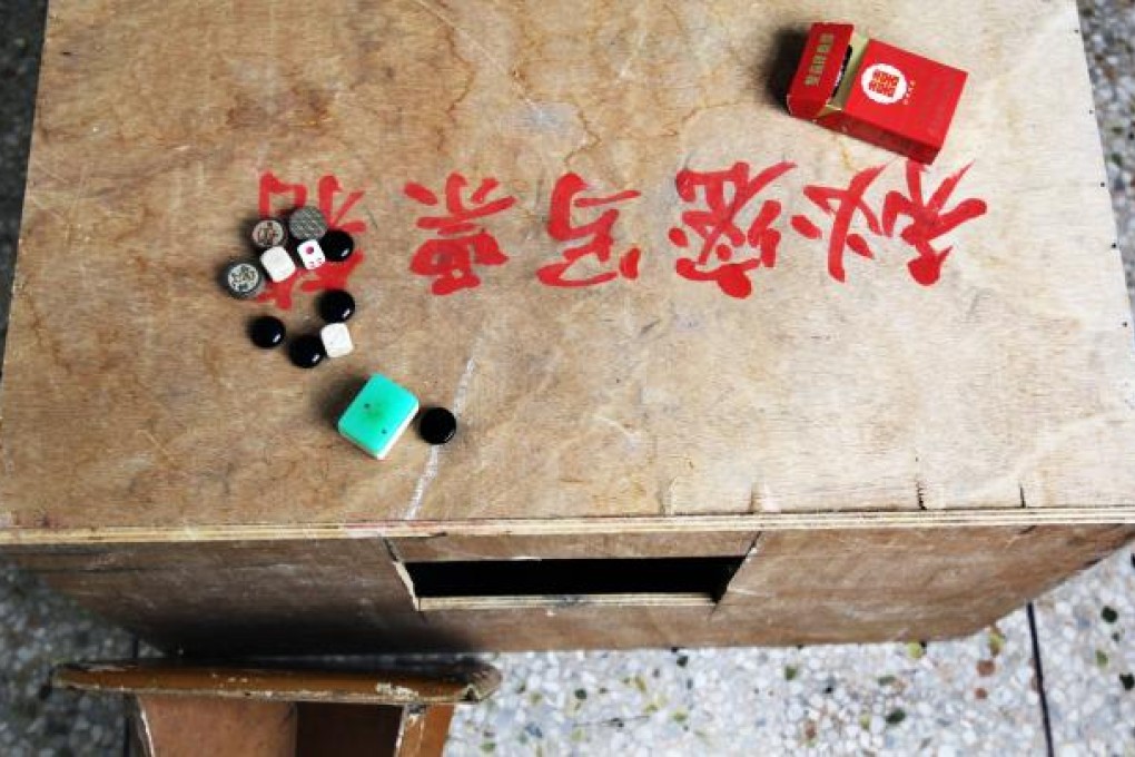 A ballot box used to elect the village representatives of Wukan is now used as a make-shift table for gambling in a centre for the elderly. Photo: SCMP