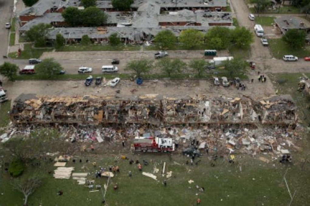 Search and rescue workers comb through what remains of a 50-unit apartment building (foreground) and the West Rest Haven Nursing Home the day after an explosion at the West Fertiliser Company destroyed the buildings. Photo: AFP