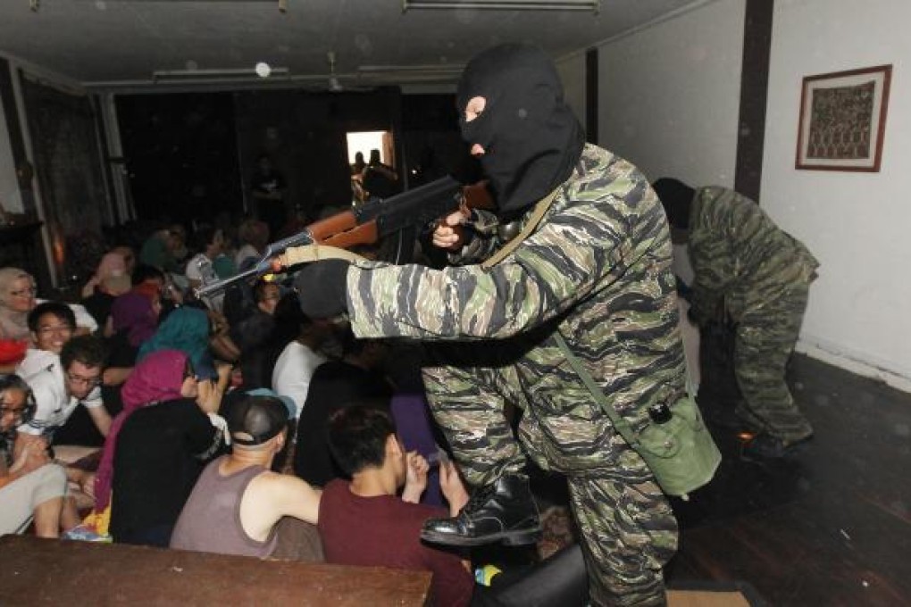 At Crossroads Village in Tuen Mun, people experience simulations aimed at conveying extreme conditions endured by refugees worldwide. Photo: Edward Wong