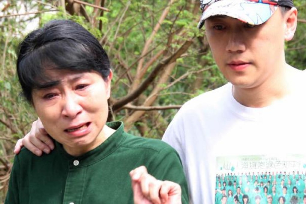 Claudia Mo (left) weeps after the discovery of Eric Tsui's body. Photo: SCMP