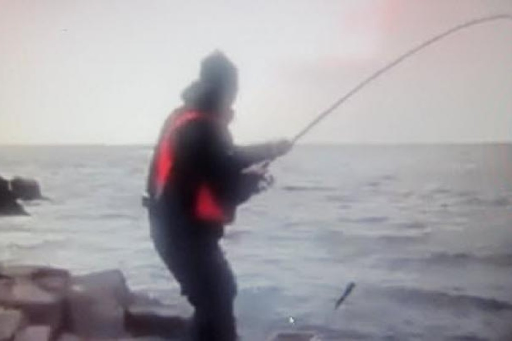 An image from the video shows the shark on the end of an angler's line in Sai Kung. Photo: Red Door News