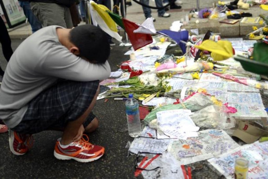 People visit a make-shift memorial on Boylston Street. Photo: AFP