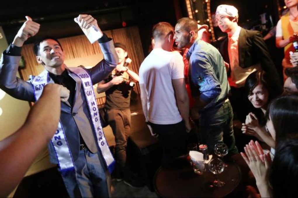 Benjie Caraig wins the Mr Gay Hong Kong title last year. Clubs find such events attract straight clientele, too. Photo: Sam Tsang