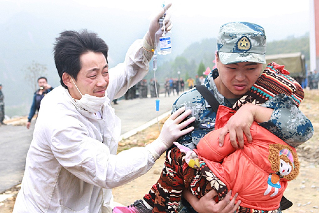 An injured child is taken for treatment in quake-hit Lushan county, Sichuan province, on Sunday. Photo: Xinhua