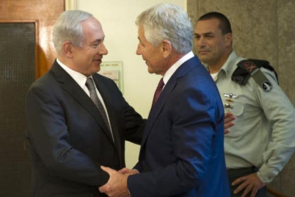 Israeli Prime Minister Benjamin Netanyahu, left, welcomes U.S. Secretary of Defense Chuck Hagel at his office in Jerusalem, on Tuesday. Photo: AP