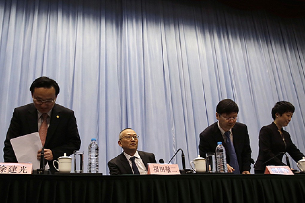 WHO and Chinese health officials hold a press conference in Shanghai. Photo: AP