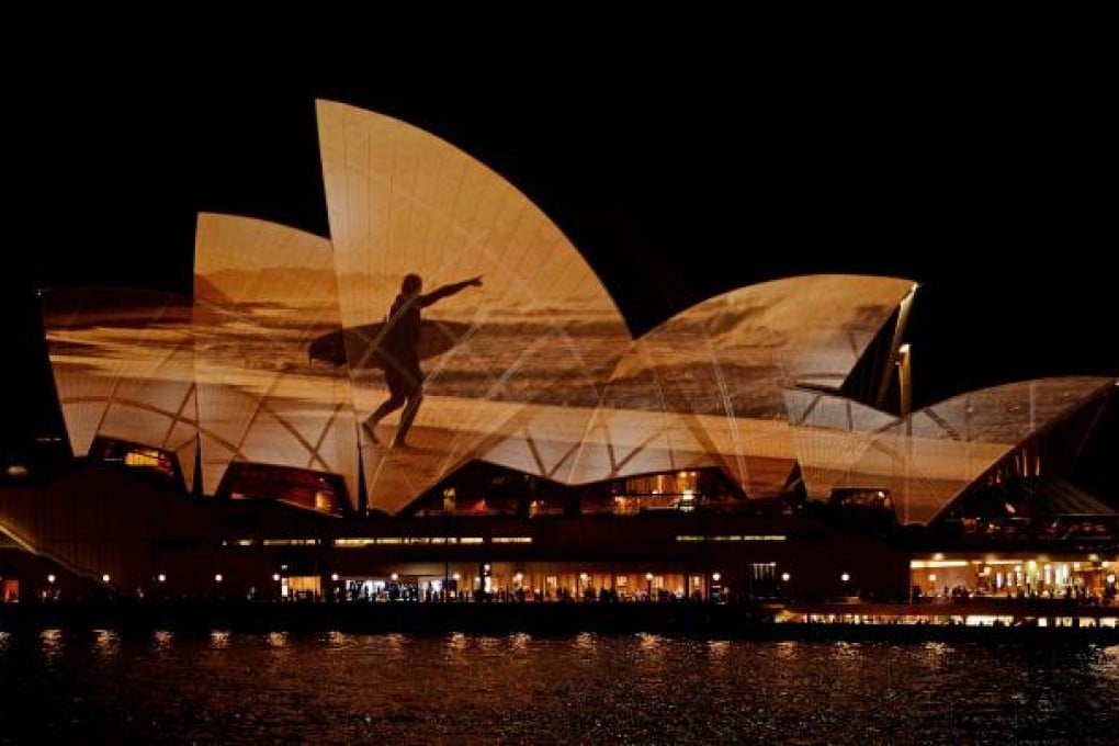 A photograph is projected onto the sails of the Sydney Opera House during the unveiling of the new Samsung GALAXY S 4 smartphone this week. The touchscreen device goes on sale in South Korea on Friday. Photo: AFP