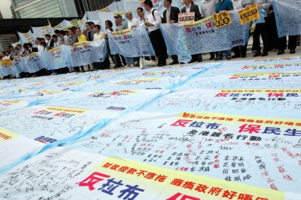 The Democratic Alliance for the Betterment and Progress of Hong Kong stages an anti-filibuster protest outside Legco. Photo: David Wong