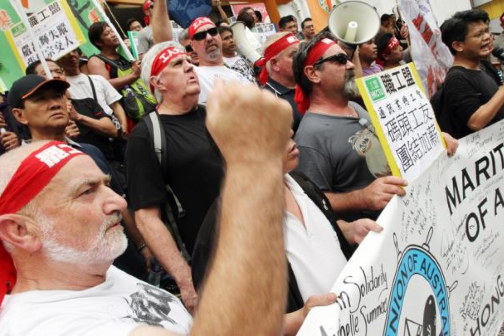 Members of Maritime Union Of Australia join striking dock workers of Kwai Chung Container Terminal in protest from the terminal to Labour Department's office in Kwai Chung. Photo: K. Y. Cheng