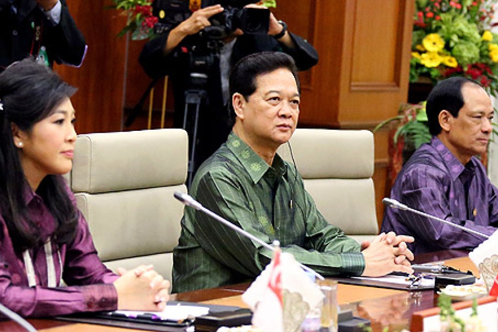 (From left) Thai Prime Minister Yingluck Shinawatra, Vietnamese Prime Minister Nguyen Tan Dung and Secretary-General of Asean Le Luong Minh at the opening ceremony of the summit. Photo: Xinhua