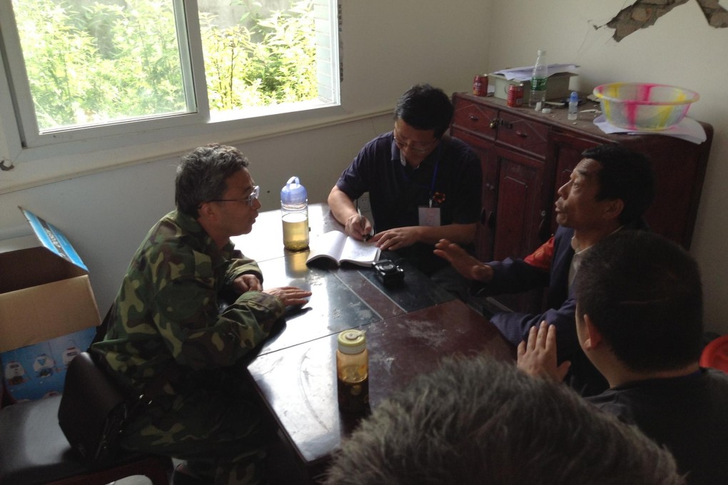 Sacked cadre Yang Changyi (left) holds a meeting.Photo: Keith Zhai