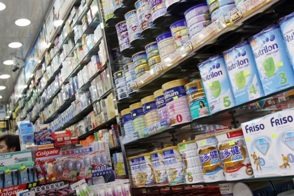 A Wan Chai pharmacy displays tins of infant formula. The membership programme aims to resolve the supply problem. Photo: David Wong