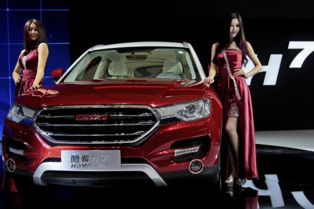 A model poses with the mainland-made Great Wall H7 SUV at the recent international automobile exhibition in Shanghai. Photo: AP
