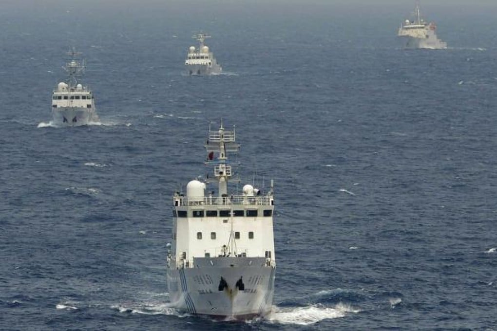 Chinese surveillance ships sail in formation in waters claimed by Japan near disputed islands called Senkaku in Japan and Diaoyu in China, on April 23. Photo: AP