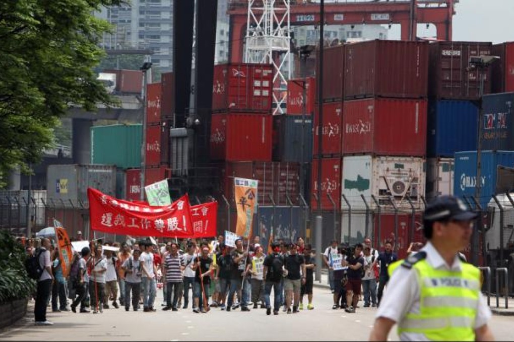 Striking dock workers stage a protest outside Kwai Chung Container Terminal. Photo: Felix Wong