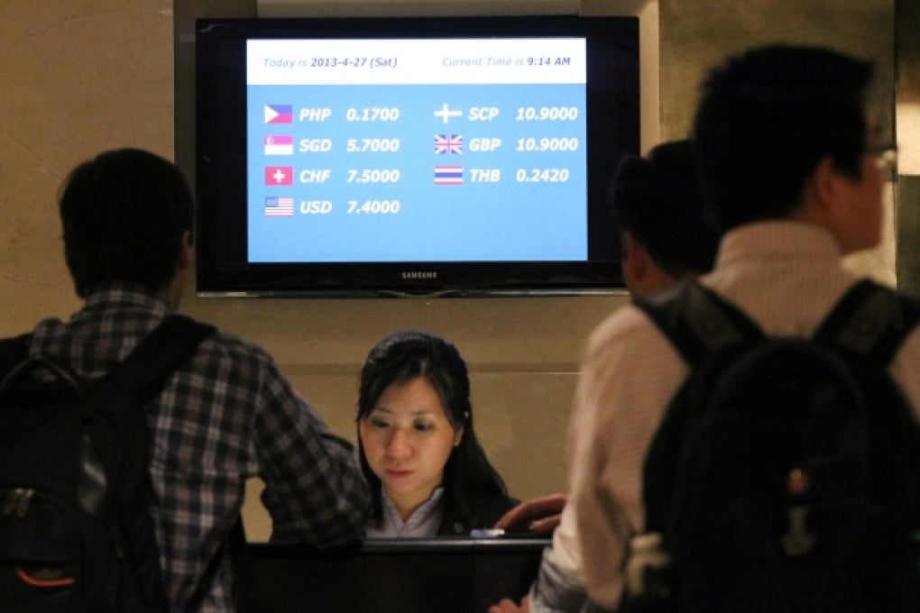 A currency rate board displays an exchange rate for the Scottish pound (SCP) at the Sheraton Hotel in Tsim Sha Tsui. Photo: Edward Wong