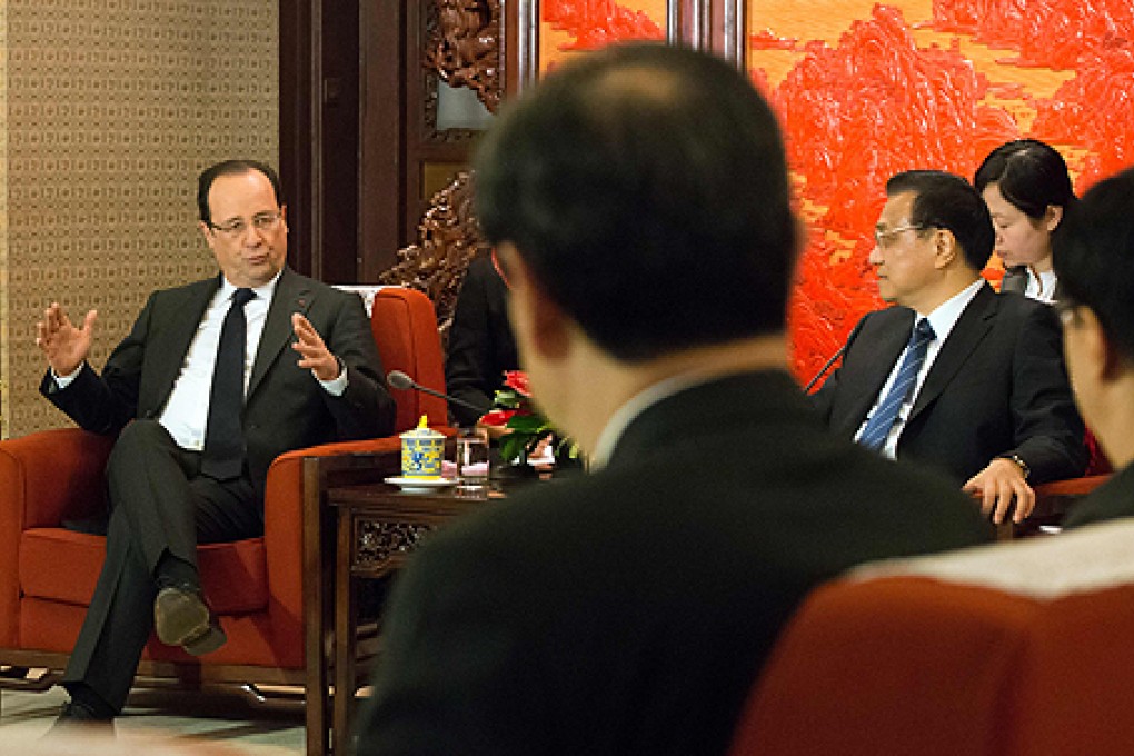 French President Francois Hollande met Premier Li Keqiang on the final day of his visit in Beijing on Friday. Photo: AFP