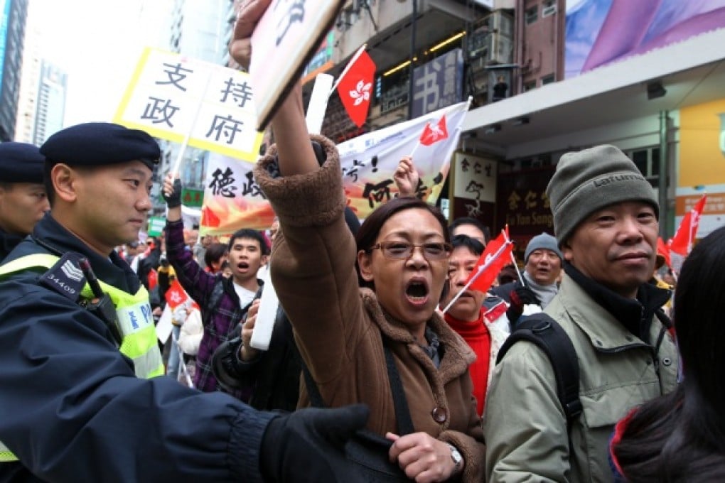 Members of Caring Hong Kong Power march to Central Government Offices form Victoria Park to support Chief Executive Leung Chun-ying.