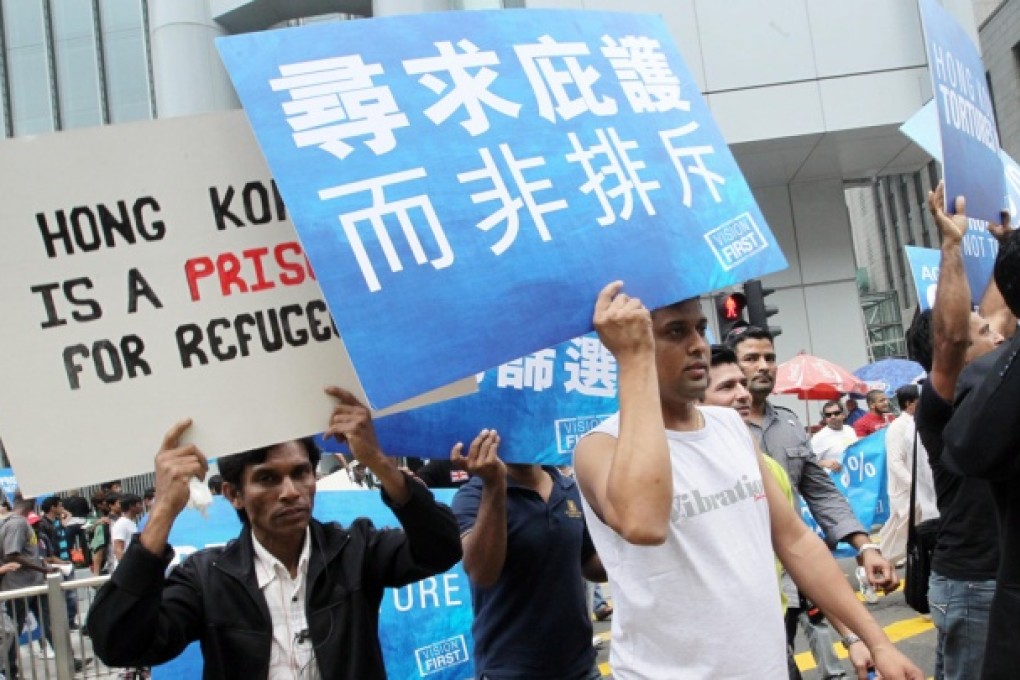 Hundreds of asylum seekers and torture claimants marched from Central to the Immigration Tower in Wan Chai yesterday to protest against what they see as the government’s failed screening process. Photo: May Tse