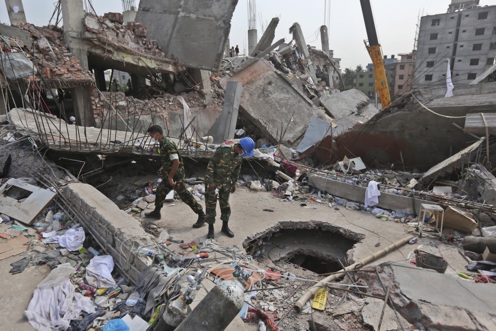 Bangladeshi rescue workers conduct a search for survivors at the site of a collapsed building in Savar, Bangladesh. Photo: AP