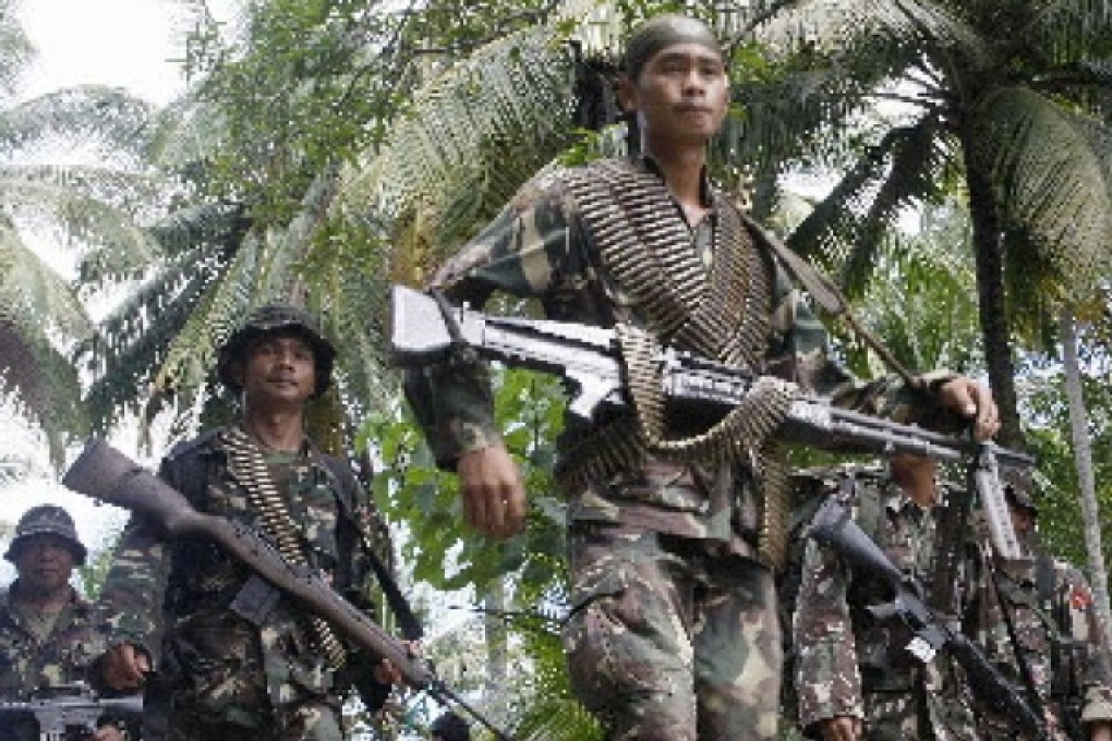 Philippine soldiers in action against rebels in Mindanao. Philippine rebels are raking in millions of dollars extorting money from election candidates, an official said on Sunday. Photo: AFP.