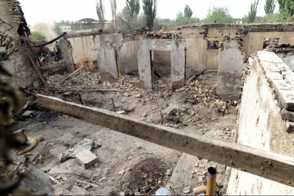 Houses destroyed in a violent clash in Kashgar. Photo: AP