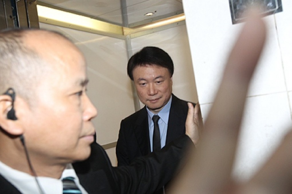 Steven Lo (right), charged alongside Joseph Lau with offering a bribe, at the court in Macau yesterday. Photo: David Wong