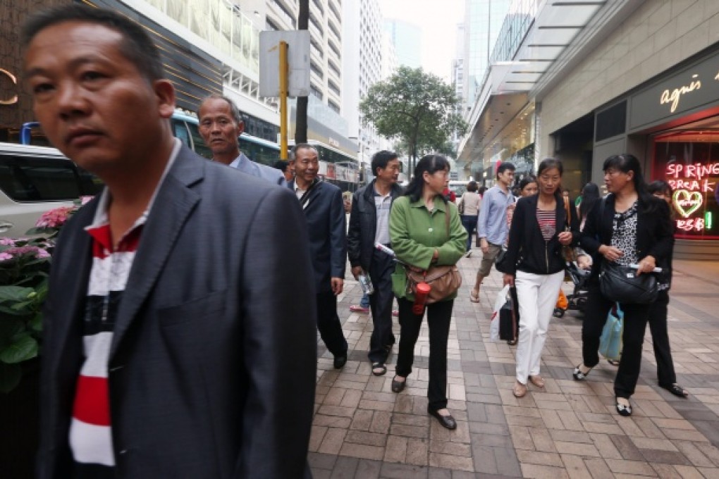 Mainland tourists make their presence felt in Canton Road, Tsim Sha Tsui, as they make a bee-line for jewellery shops yesterday. Photo: Sam Tsang