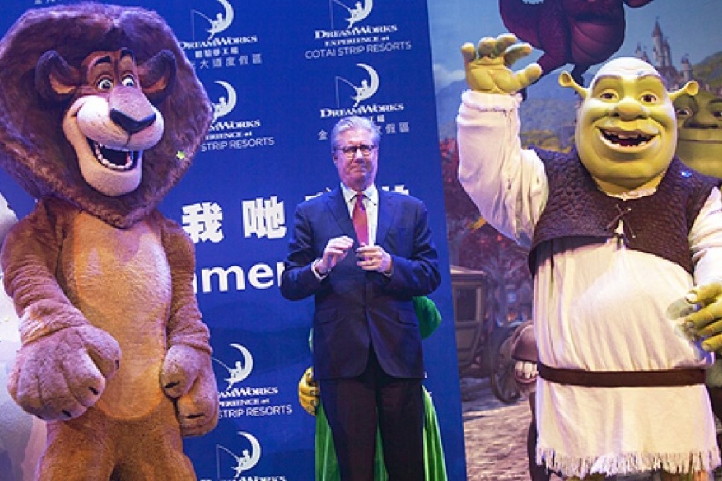 Edward Tracy, President and CEO of Sands China, stands in between DreamWorks animation characters Alex and Shrek, at the Venetian casino, Macau, on Tuesday. Photo: EPA