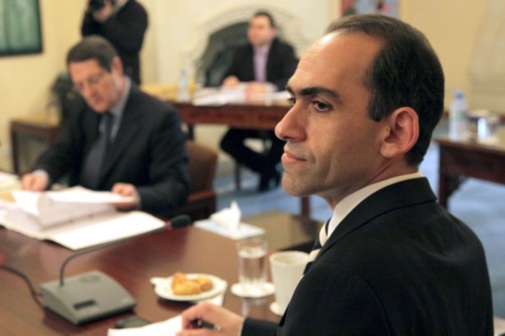 Cyprus’s Finance Minister, Haris Georgiades, has warned that the tiny Mediterranean island could be forced out of the euro if it doesn’t approve a bailout. Photo: AFP