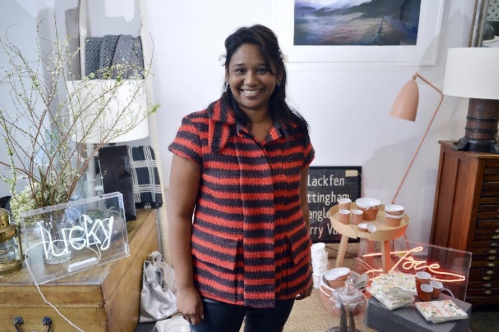 Joanne Pereira in her Sheung Wan store; the ''Love'' neon sign costs HK$4,200, the ''lucky'' neon sign is HK$4,000. Photos: Warton Li