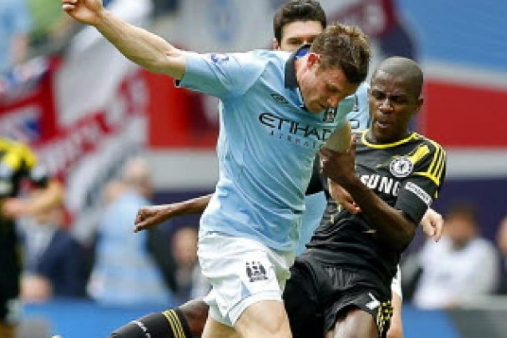Chelsea's Ramires (right) in action against James Milner (left) of Manchester City during the English FA Cup semi final soccer match. The English FA is now searching for the living descendants of the founding fathers of football