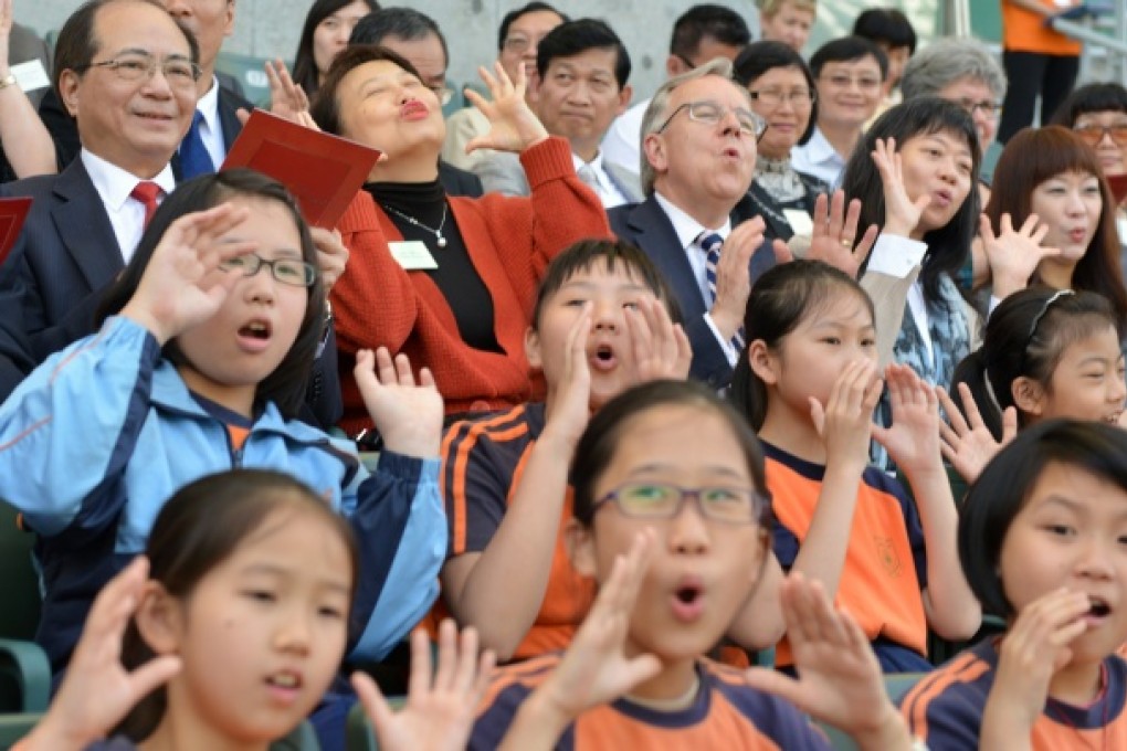 Eddie Ng Hak-kim, Secretary for Education and Cherry Tse, Permanent Secretary for Education join about ten thousand students join World Book Day event and recite the works of Shakespeare in Hong Kong Stadium. Photo: Thomas Yau