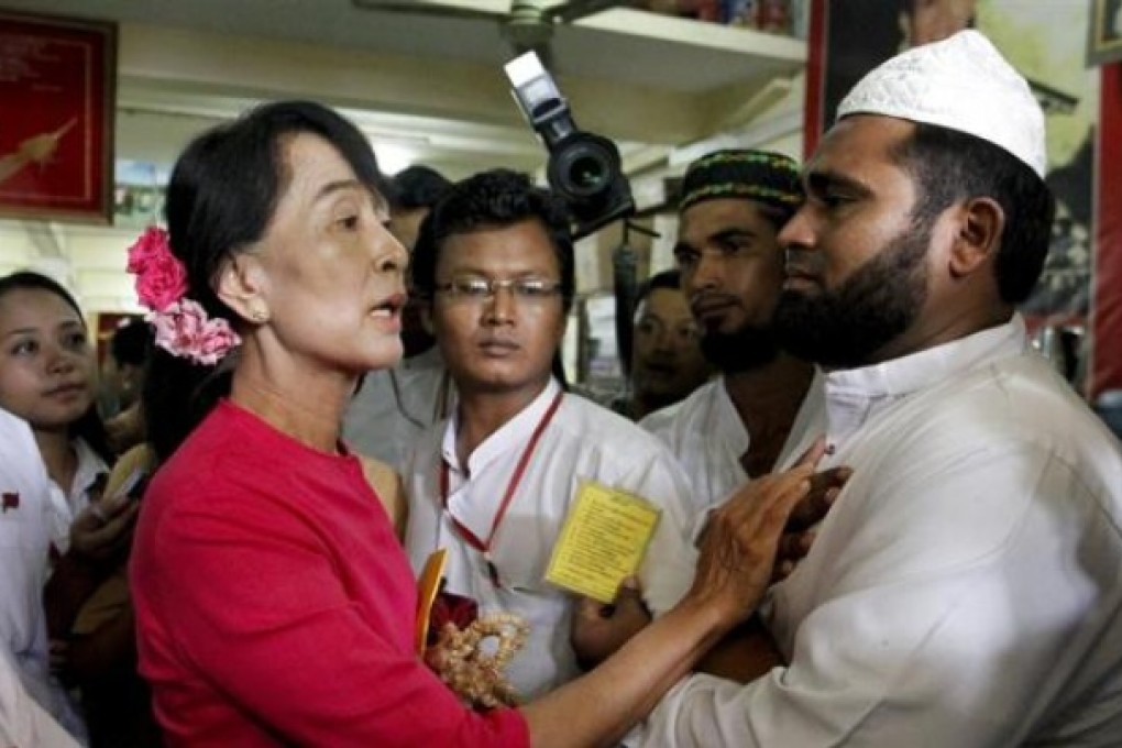 Myanmar's pro-democracy leader Aung San Suu Kyi talks to Myanmar Muslims leaders. There have been more anti-Muslim riots in Myanmar. Photo: Reuters